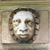 high up on the elevation of Wollaton Hall is this extraordinary, lifelike, carved stone head of a Negro man dating from ca.1580, the year that Francis Drake completed his circumnavigation of the globe